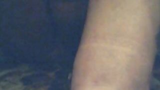 Rubbing her hairy pussy before pissing