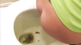 Sexy brunette lady pooping in the toilet for you