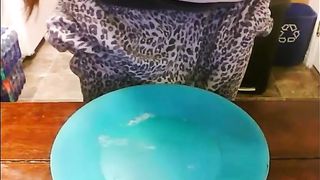 Girl shitting on a blue plate
