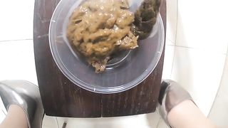 Lovely Chinese scat babe fills bowl with huge poop