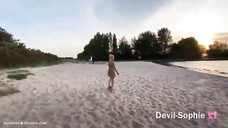 Lovely blonde lady pooping nicely on the beach