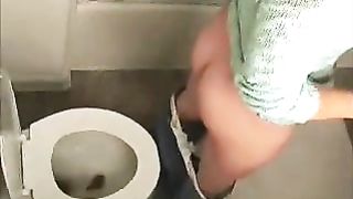 Cute amateur brunette poops in the toilet