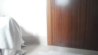 Slim shy girl poops into cup