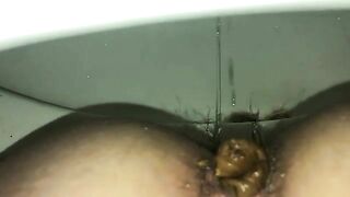 Closeup of thick green poop and hairy ass