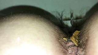 Closeup of thick green poop and hairy ass