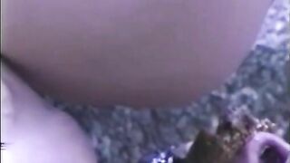 Sexy brunette lady pooping on the slave outdoor