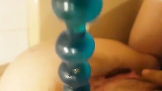 Lady masturbates and poops on her anal beads
