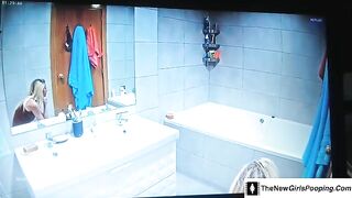 Blonde taking a dump in the toilet