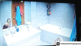 Blonde taking a dump in the toilet