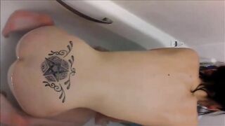 Tattooed brunette lady poops hard
