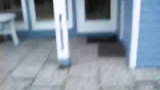 Brunette wife pooping in front of the house door