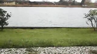 Curvy ass lady pooping in the garden