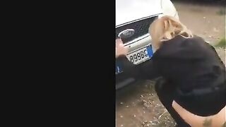 Blonde milf poops in front of the car