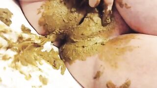 Pregnant bitch plays with her messy shit
