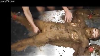 Naughty busty Asian covered heavily in wet shit