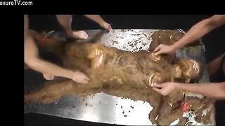 Naughty busty Asian covered heavily in wet shit