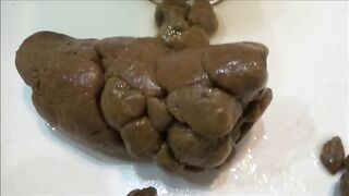 Cute blonde naked babe poops