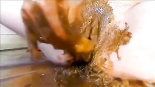 Woman pisses on the floor and makes a mess with her feet