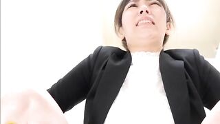 Cute young Japanese girl pushing thick dry load