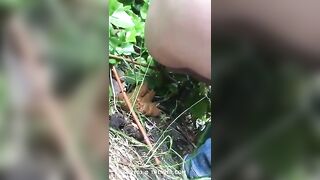Young lady shitting in the forest