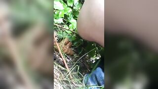 Young lady shitting in the forest