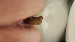 Closeup hot lady pooping