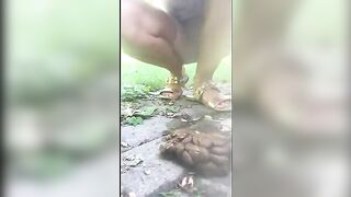 Asian girl poops heavily in the park