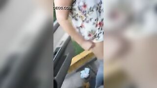 Chubby girl pooping behind the car