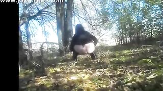 Sexy big bottom lady pooping in the forest