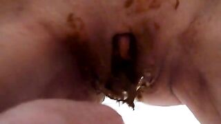 Dirty lady pooping in her hand