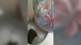 Tattooed pooping babe