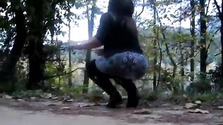 Two hot babes pooping in the woods