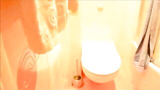 Lovely round ass chick pooping in the toilet