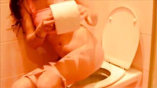 Lovely round ass chick pooping in the toilet