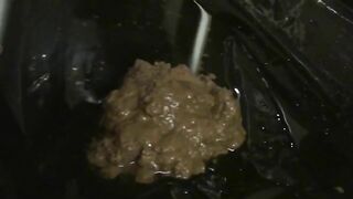 Pretty babe smearing shit on her sexy body and face