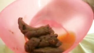 Sexy hot bitch pooping in the plastic bowl