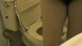 Hairy busty poops in the toilet