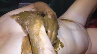 Smearing shit on her boobs