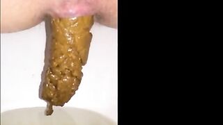 Girl shitting long hard turd