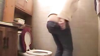 Amateur blonde lady poops in the toilet