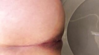 Dark hard juicy turd in the toilet