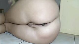 Girl uses a big green pickle in her ass