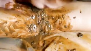 lesbians playing with shit spit together