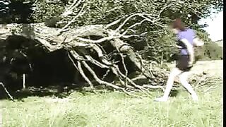 Lovely blonde lady pooping in the nature