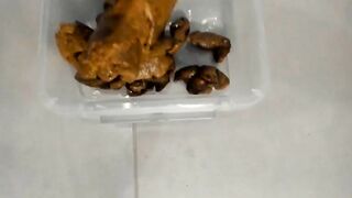 Slim blonde poops hard turds