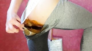 Cute brunette girl in mask smearing shit in her panty