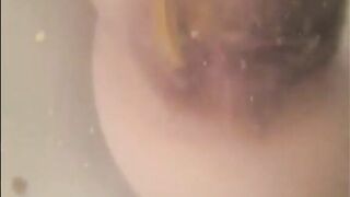 Woman shitting in the bathtub