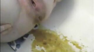 Woman shitting liquid poop after enema