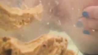 Woman shitting diarrhea in the bathtub