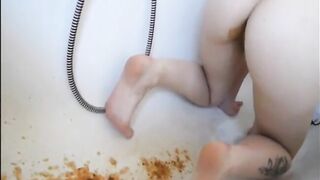 Young girl shitting in the bathtub